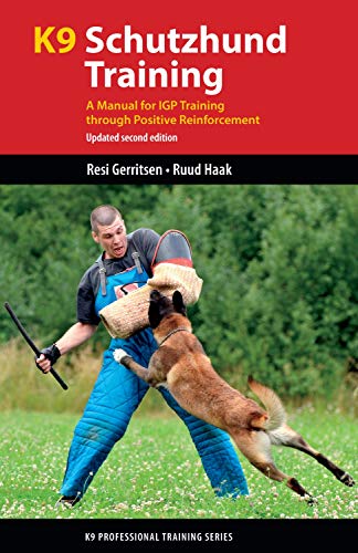 Book cover showing a dog biting a protective sleeve worn by a trainer.