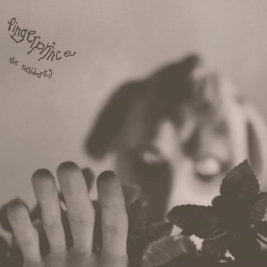 Sepia-toned vinyl record cover with blurred hand and foliage imagery.