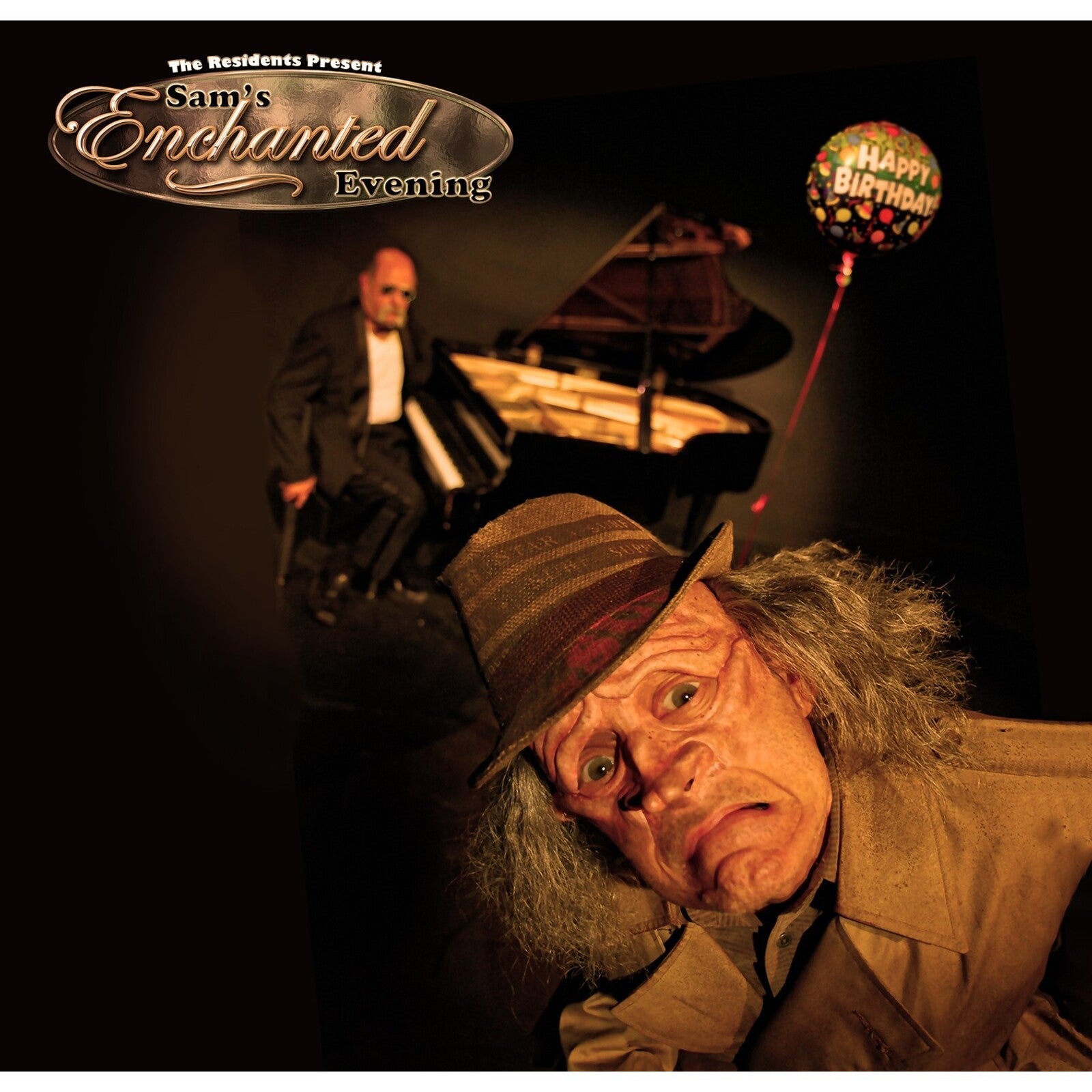 CD cover: a costumed figure, piano, and birthday balloon in a dark room.