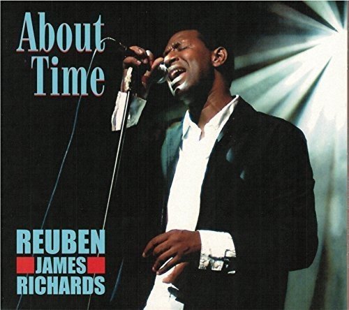 "Album cover featuring a man singing into a microphone, wearing a black suit jacket."