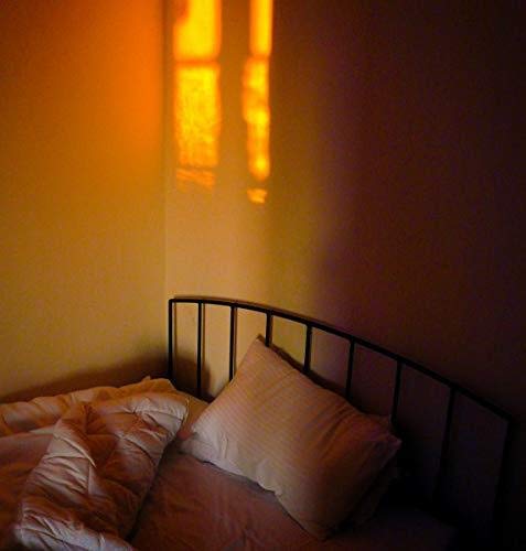Vinyl record artwork depicting an orange, blurred bedroom scene.