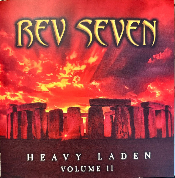 CD cover for “Rev Seven - Heavy Laden Volume 2” with stonehenge imagery.