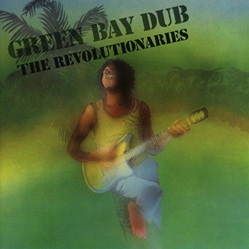 Album cover: Man playing guitar amidst green and blue foliage.