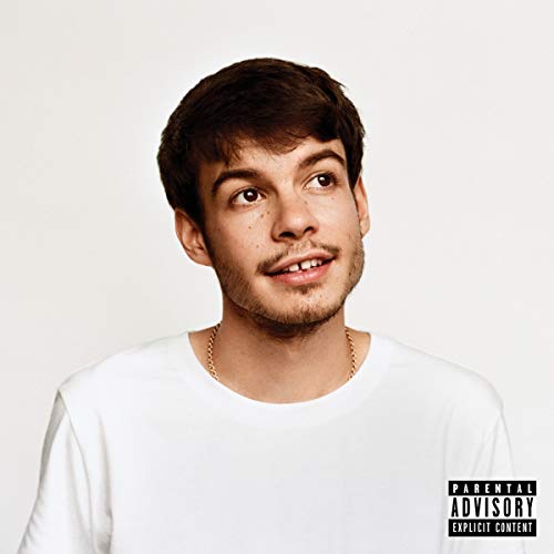A portrait of Rex Orange County wearing a white t-shirt against a white background.