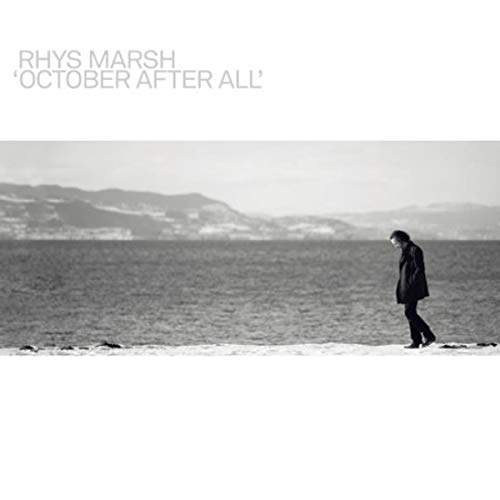 Black and white album cover featuring a lone figure by the sea.