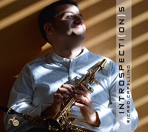 Man holding saxophone, smiling, with album title "Introspecti(on)s" on the right side.