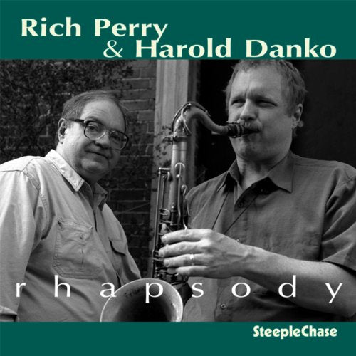 Black and white photo of two men with a saxophone, album cover.