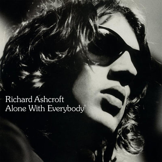 Black and white portrait of Richard Ashcroft wearing sunglasses, album cover.