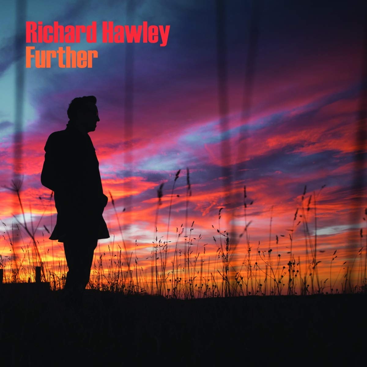 Album cover with silhouette of man standing in tall grass at vibrant orange and red sunset.