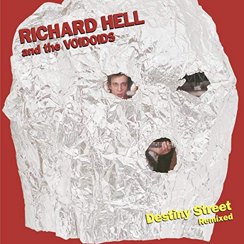 Album cover with crumpled foil, three peepholes, and red and yellow text on red background.