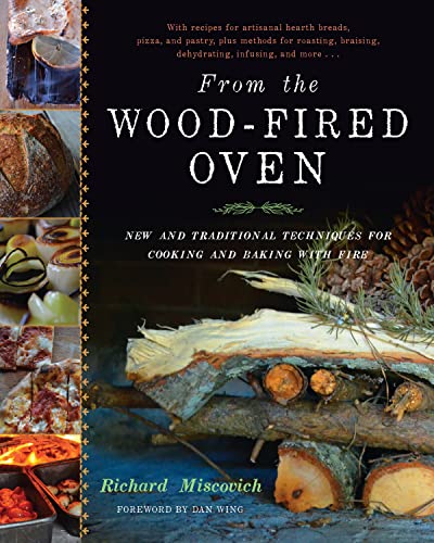 Cookbook cover featuring wood-fired oven cooking, breads, and a log with pinecones.