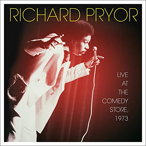 Richard Pryor performing stand-up comedy with a microphone, album cover.