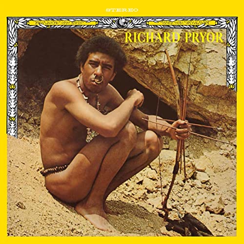 Richard Pryor album cover: a shirtless man crouching in a cave entrance.