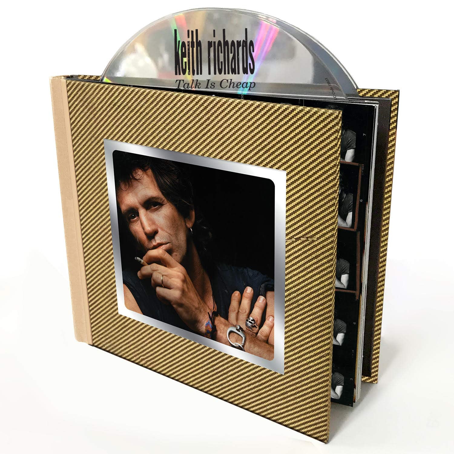 "CD box set with gold cover, featuring a photo of Keith Richards."