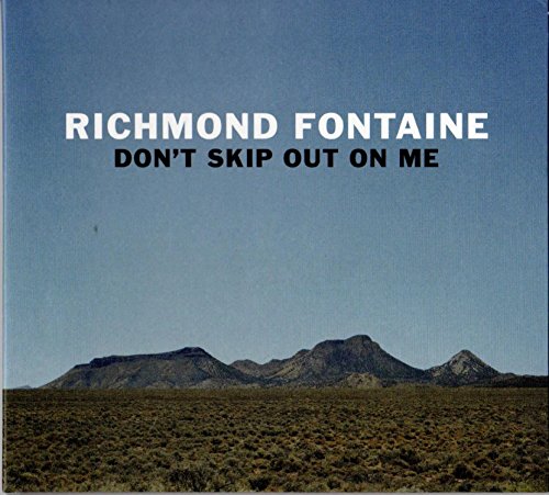 CD cover showing desert landscape with mountains under a clear blue sky.