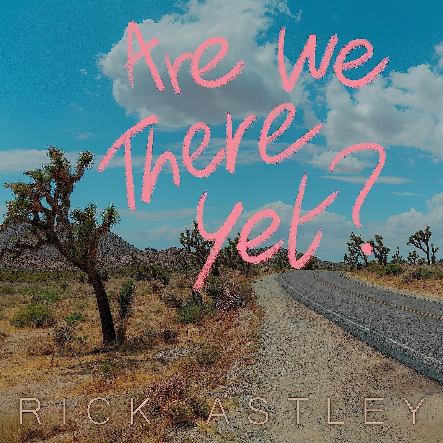 Rick Astley album cover: desert road with pink text overlay.