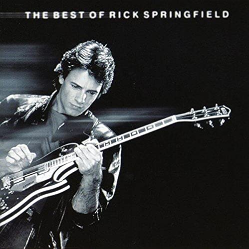 Rick Springfield album cover, black and white photo of him playing guitar.