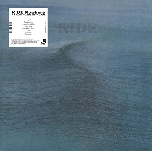 Vinyl album cover featuring a blue ocean wave with a tracklist sticker in corner.