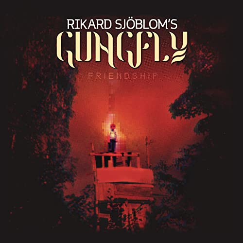 Red album cover featuring a lone figure on a small, foggy island.