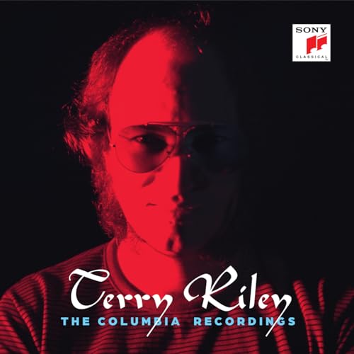 CD cover: Portrait of Terry Riley with red lighting and text.
