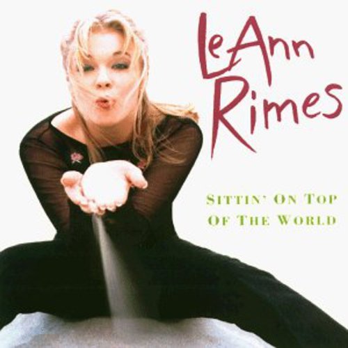 LeAnn Rimes album cover, portrait of a young woman blowing a kiss.