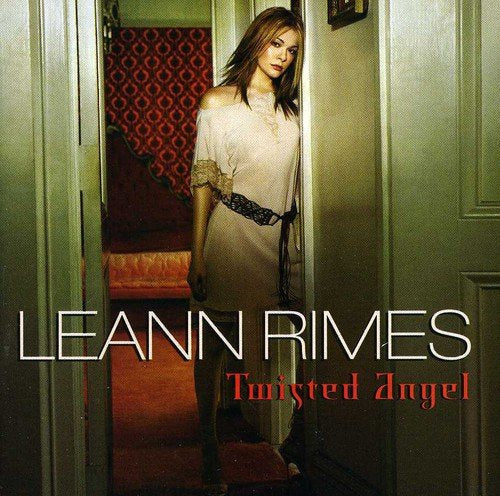 LeAnn Rimes album cover, "Twisted Angel," features her in a doorway.
