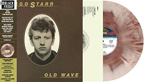 Vinyl record with brown and white marbled effect, featuring a portrait of Bob Dylan.
