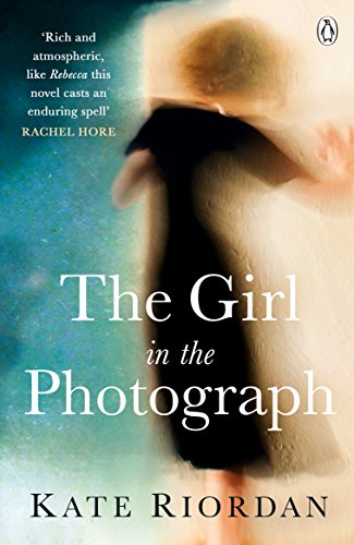 Book cover: woman’s face obscured by shadow, title “The Girl in the Photograph”.