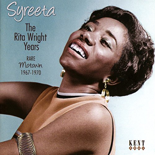 "Syreeta album cover featuring a smiling woman with short hair against a green background."