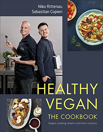 Cookbook cover with two chefs and vibrant vegan food photography.