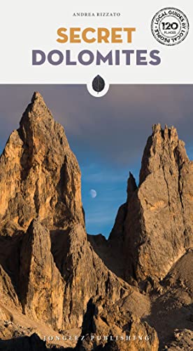 Book cover titled Secret Dolomites featuring jagged mountain peaks under a blue sky.