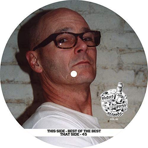 Vinyl record label featuring a portrait of a man with glasses.