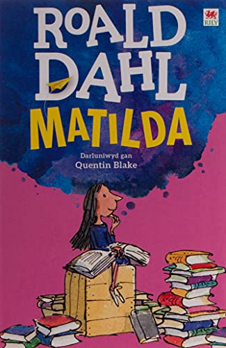 Book cover of "Matilda" in Welsh, featuring a girl reading amongst books.