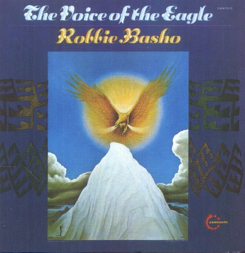 "Album cover with a golden eagle flying over a mountain peak."