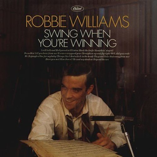 Robbie Williams album cover, “Swing When You’re Winning”, featuring a man with a microphone.