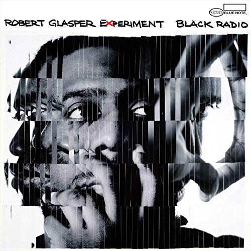 Black and white album cover featuring a fragmented portrait of Robert Glasper.