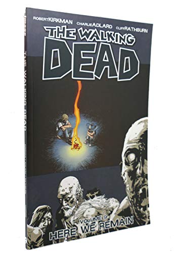 The Walking Dead" graphic novel, volume 9, cover with figures around a fire.