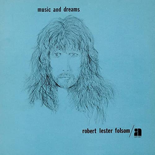 Vinyl album cover with a line drawing of a man on a blue background.