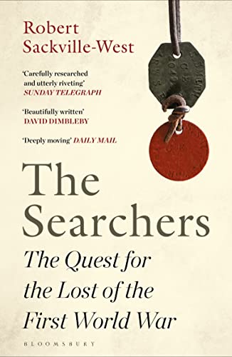 Book cover for The Searchers featuring two hanging World War I military identification tags.