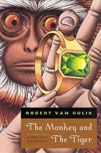 A monkey holds a large gold ring with a green gemstone in front of its face.