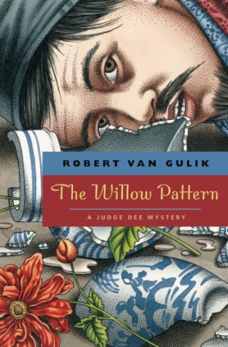 Book cover: close-up of a face, broken porcelain, and floral design.