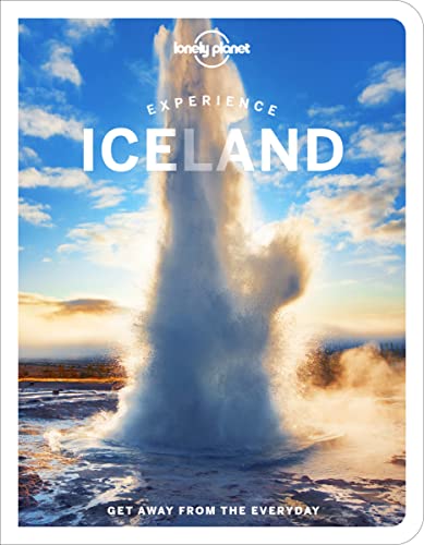 Lonely Planet Iceland travel guide cover with a geyser erupting.