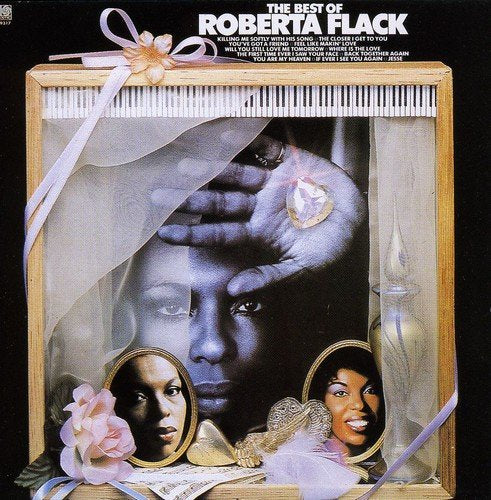"CD cover art featuring Roberta Flack's face in a wooden box with piano keys."
