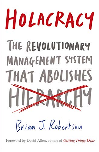 Book cover with the title Holacracy and the word hierarchy crossed out in red.