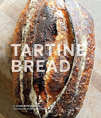 Close-up of a dark, crusty loaf of bread with the title "Tartine Bread".