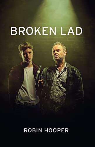 Book cover: two men stand against a dark brick wall, title “Broken Lad”.