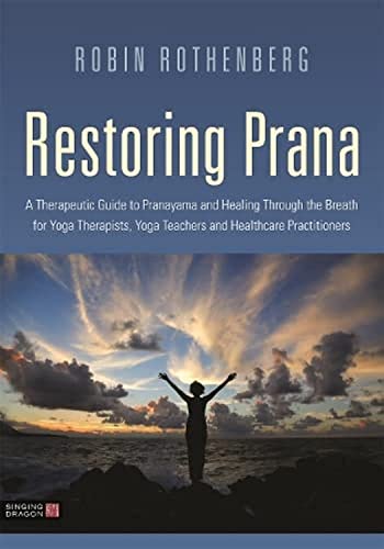 Book cover: “Restoring Prana” with silhouette of person at sunset.