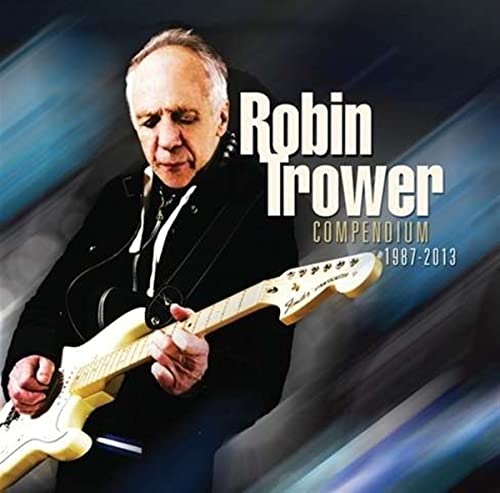 Robin Trower holding a white electric guitar, album cover art.