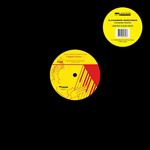 Clear vinyl record with yellow label featuring abstract line art.