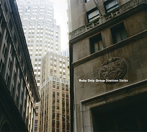 CD cover with a low-angle view of city buildings.